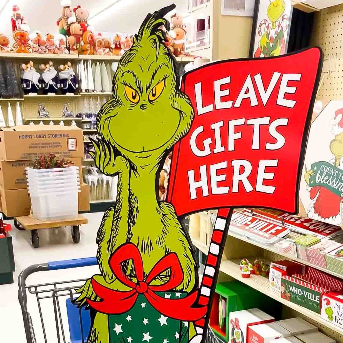 Large Grinch sign that says Leave gifts here