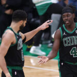 Jrue Holiday and Jayson Tatum celebrate a play during Game 2 of the NBA Finals.
