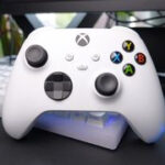 The Xbox Wireless Controller in white sat on a desk.