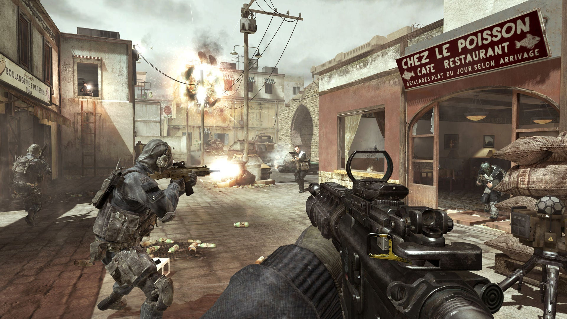 A squad shooting guns near a french restaurant