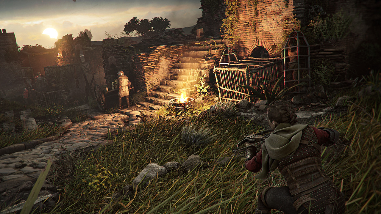 Amicia sneaks through tall grass and aims her crossbow at a nearby enemy during dusk in A Plague Tale: Requiem, which highlights the stealth gameplay.
