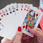 Group of people playing bridge at a table
