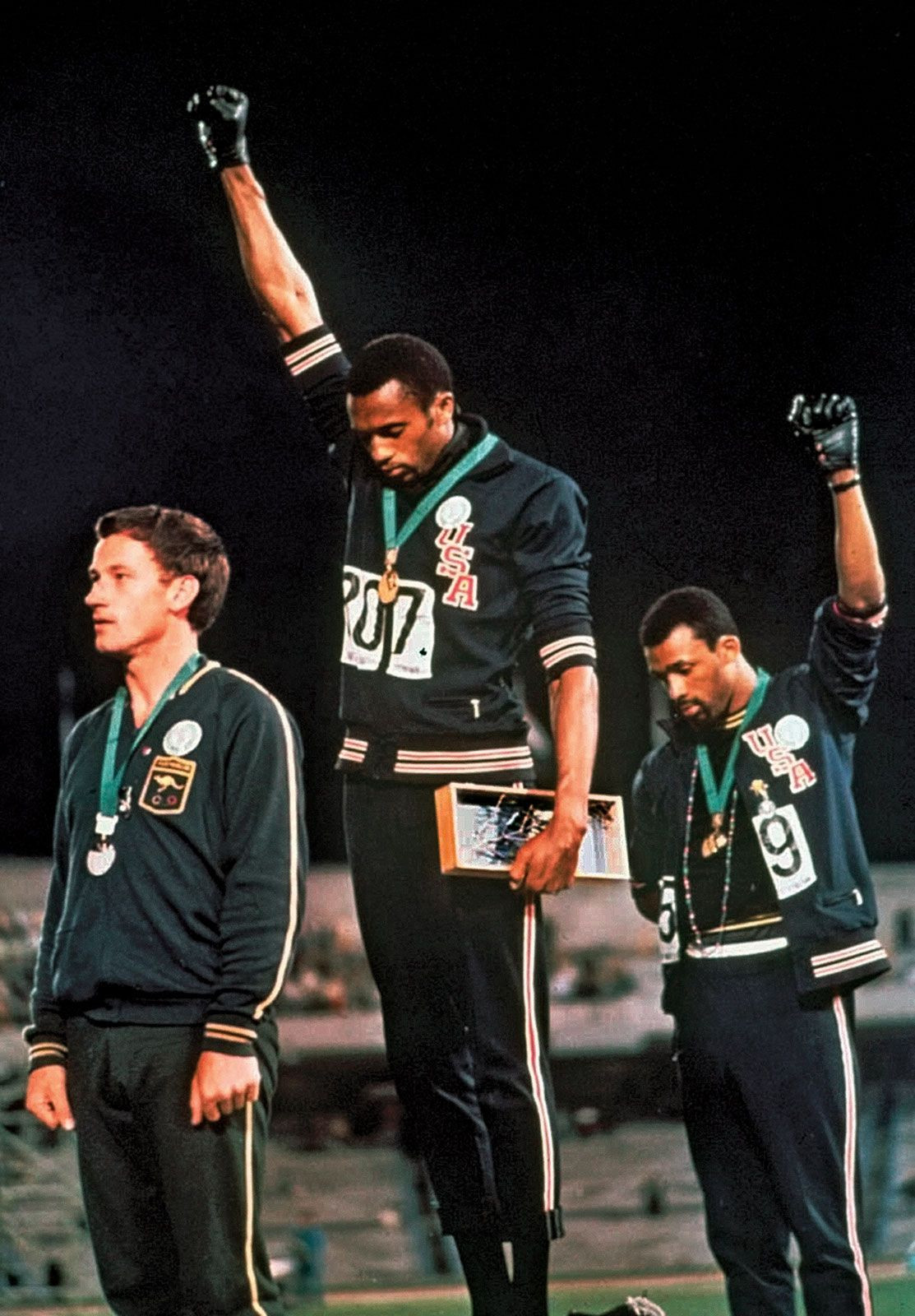 Tommie Smith and John Carlos Raising Black-Gloved Fists During the 1968 Olympic Games
