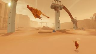 Two players walking across a desert during Journey.